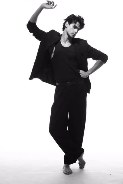 Black-and-white full-length editorial portrait photographed by Thing Studio